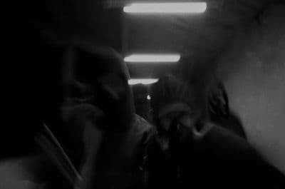 a blurry photo of a person talking on a cell phone