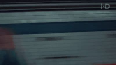 a blurry image of a person walking on a train track