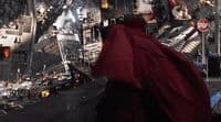 a man dressed in a red cape and a red cape