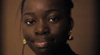a close up of a person wearing earrings