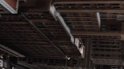 the underside of a building with a clock on it