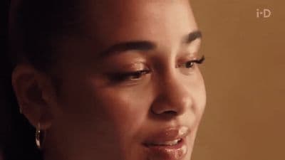 a close up of a person wearing a necklace