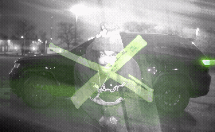 a black and white photo of a person holding a cross
