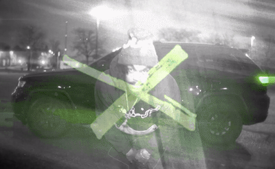 a black and white photo of a person holding a cross