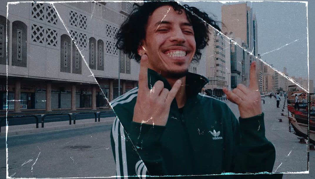 a man making a peace sign with his hands