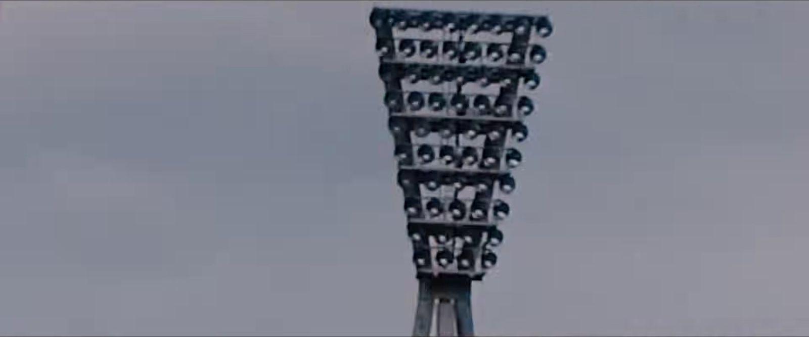 a tall metal structure with a sky in the background