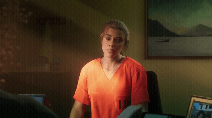 a woman in an orange shirt standing in a room