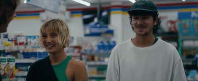 a man and a woman standing in a store