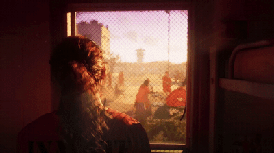 a woman looking out a window at a group of people