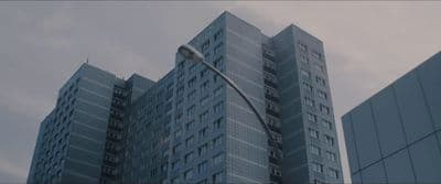 a tall building with a street light in front of it