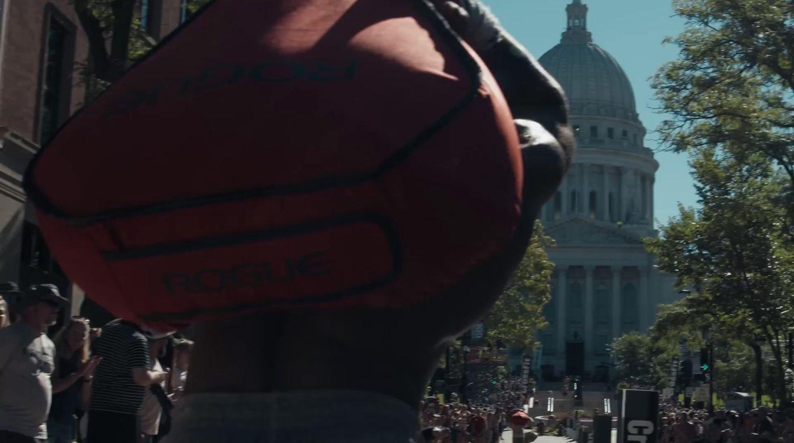 a giant red ball in the middle of a city street
