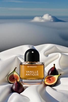 a bottle of perfume sitting on top of a white sheet