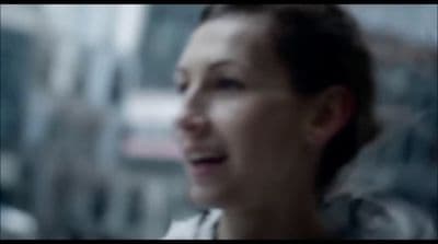 a blurry photo of a woman talking on a cell phone