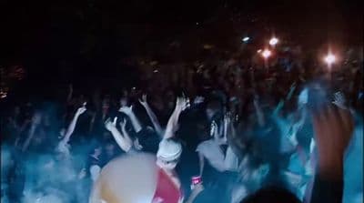 a group of people standing in front of a crowd
