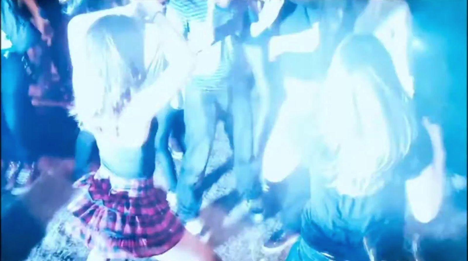 a group of people standing around each other