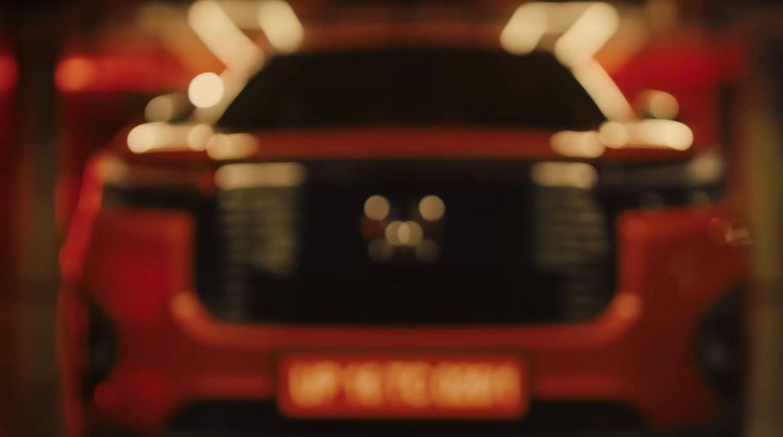 a close up of a red car in a garage