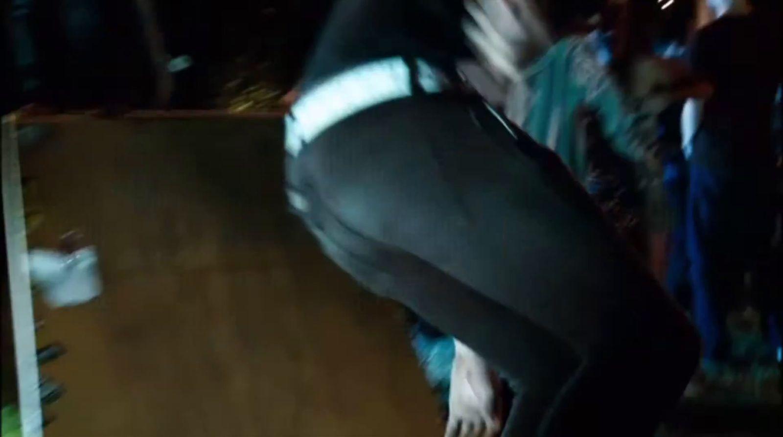 a man riding a skateboard down a wooden ramp