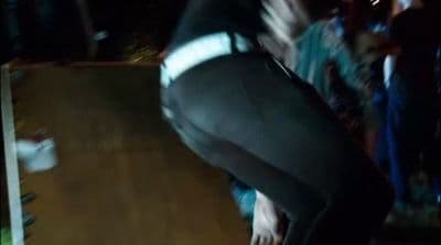 a man riding a skateboard down a wooden ramp