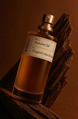 a bottle of perfume sitting on top of a piece of wood