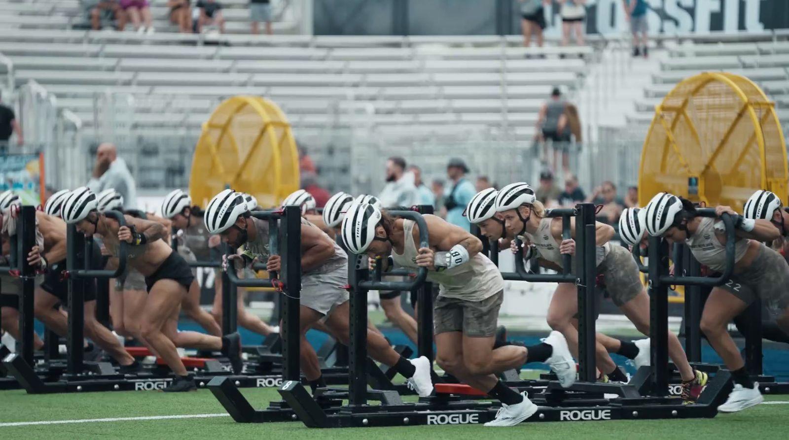 a group of people doing squats on a field