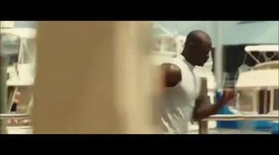a man in a white shirt is walking