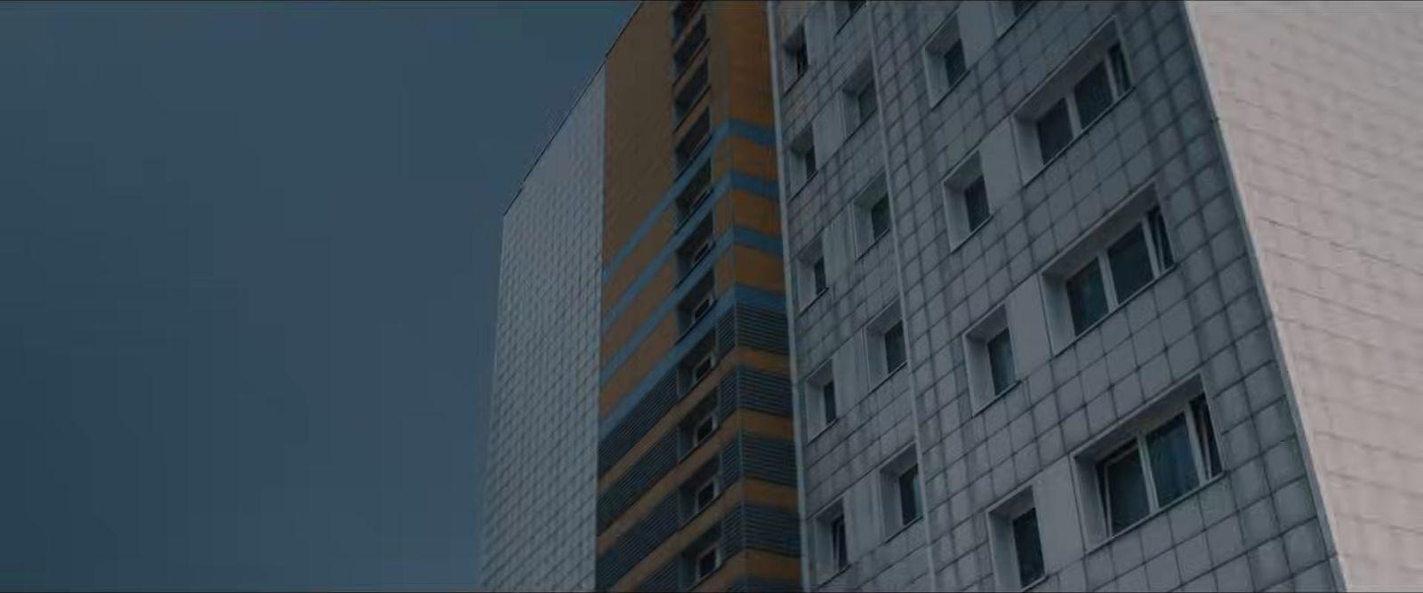 a tall building with a sky background