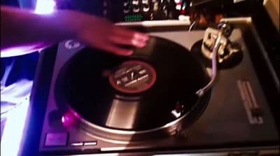 a person that is touching a record player