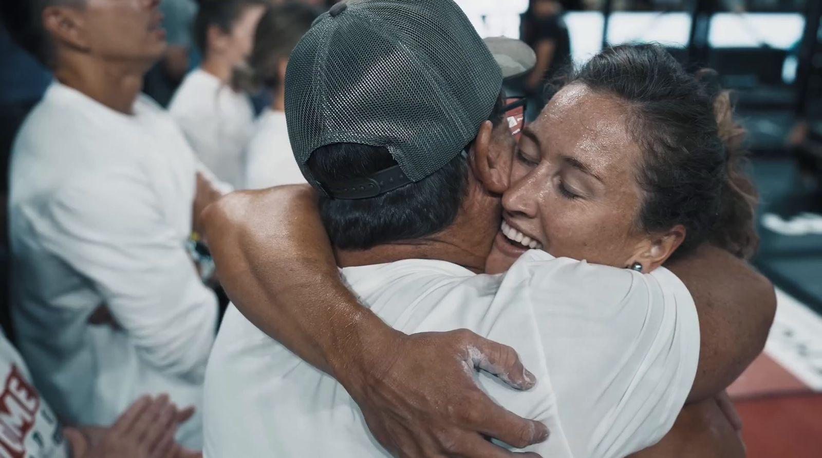 a couple of people that are hugging each other