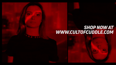 a woman standing in front of a red light