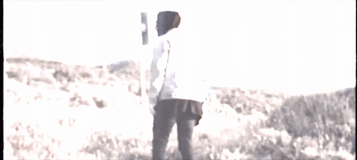 a man holding a baseball bat on top of a field