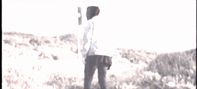 a man holding a baseball bat on top of a field