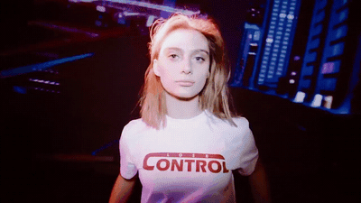 a woman with a white shirt that says control on it
