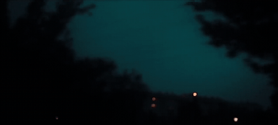 a blurry photo of a street light at night