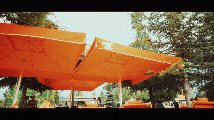a group of orange umbrellas sitting next to each other