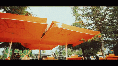 a group of orange umbrellas sitting next to each other