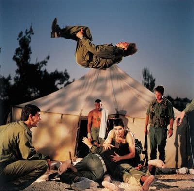 a man flying through the air while riding a skateboard
