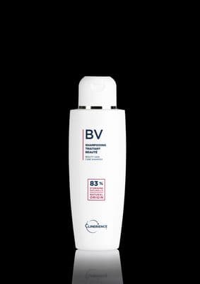 a bottle of shampoo on a black background