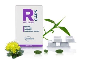 a box of r caps next to some flowers