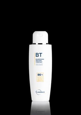 a bottle of lotion on a black background