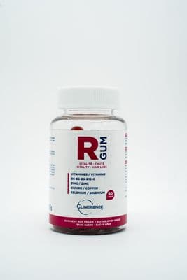 a close up of a bottle of pills on a white background