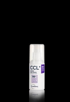 a close up of a bottle of deodorant on a black background