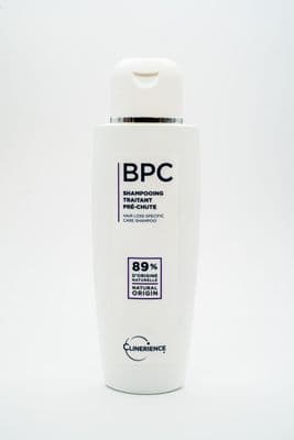 a bottle of bbc shampoo on a white background