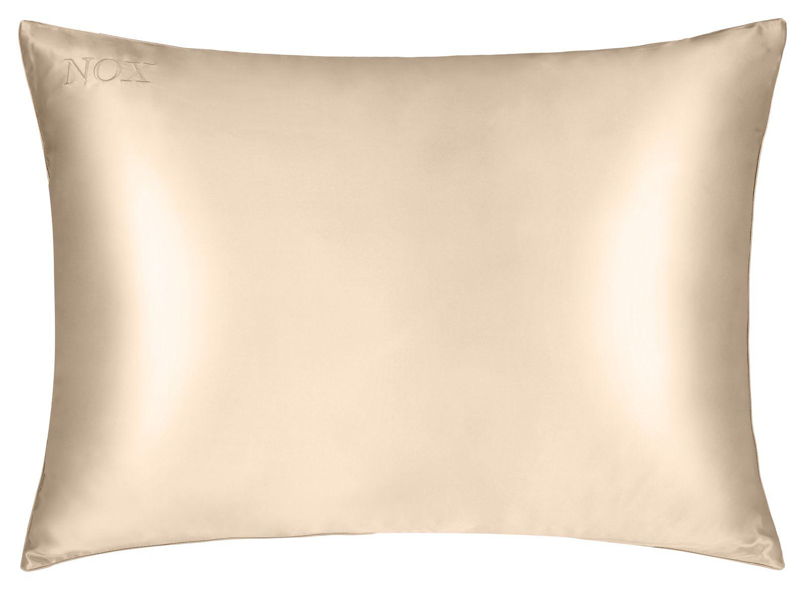 a beige pillow on a white background