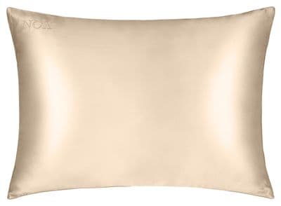a beige pillow on a white background