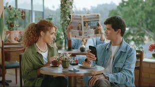 a man and a woman sitting at a table