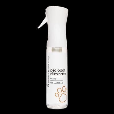 a bottle of pet odor eliumiator on a black background