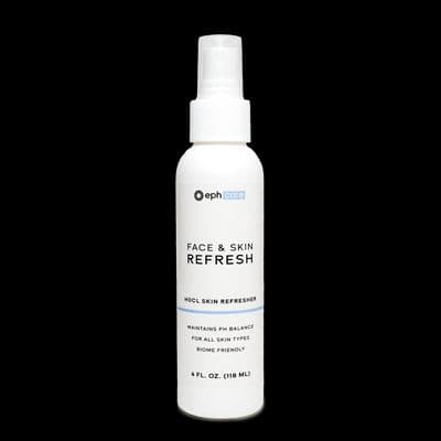a bottle of face and skin refreshant on a black background