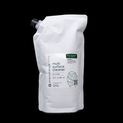 a white bag of coffee sitting on top of a black table