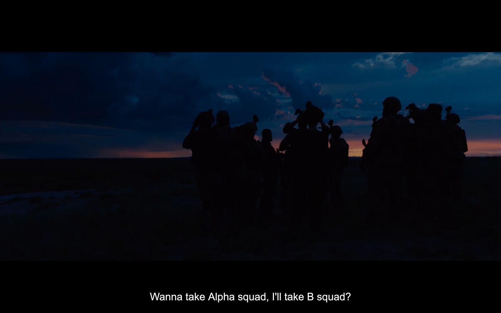 a group of people that are standing in the dark