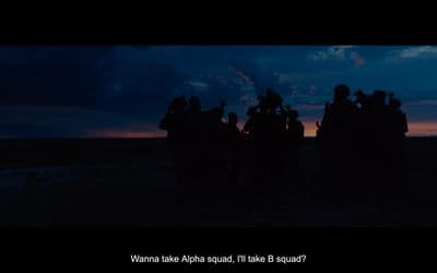 a group of people that are standing in the dark